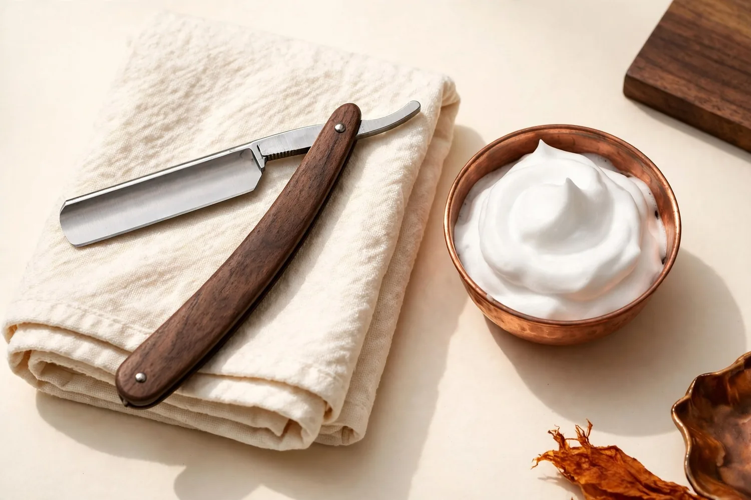 A straight razor and shaving cream